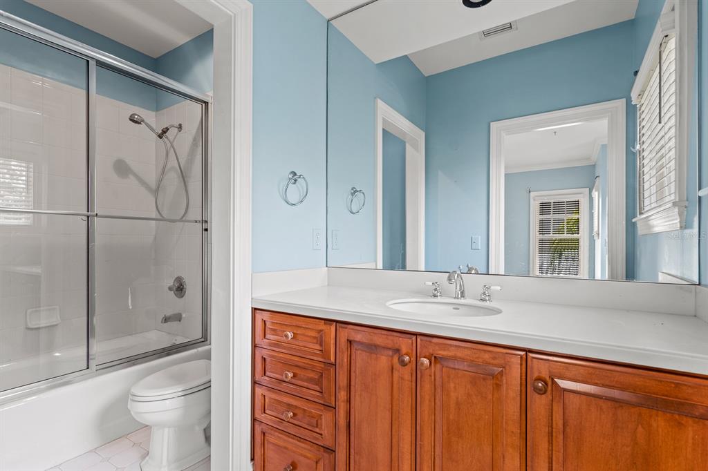 1029 Royal Pass Road Tampa, FL 33602 - Photo 53 of 68 a bathroom with a granite countertop sink toilet and shower