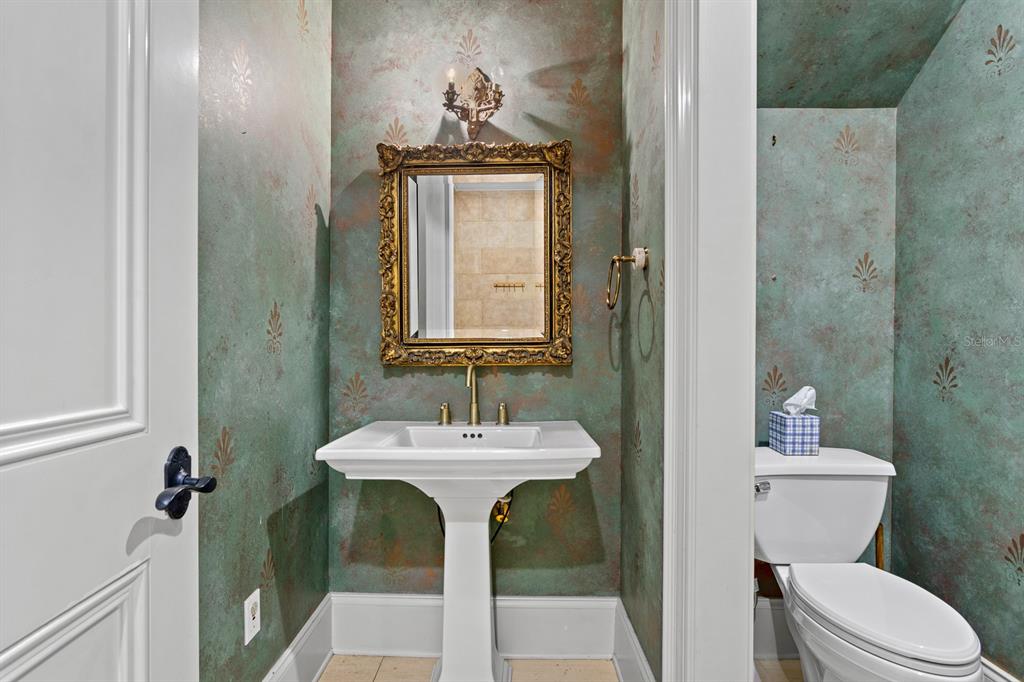 1029 Royal Pass Road Tampa, FL 33602 - Photo 54 of 68 a bathroom with a sink a toilet and mirror