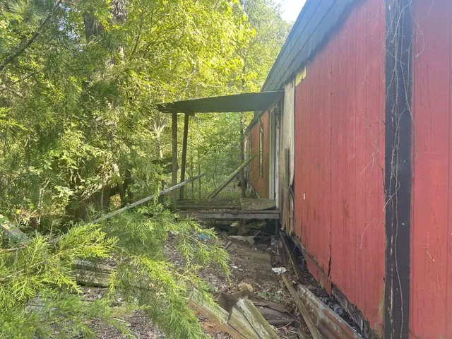 a view of a back yard from a room