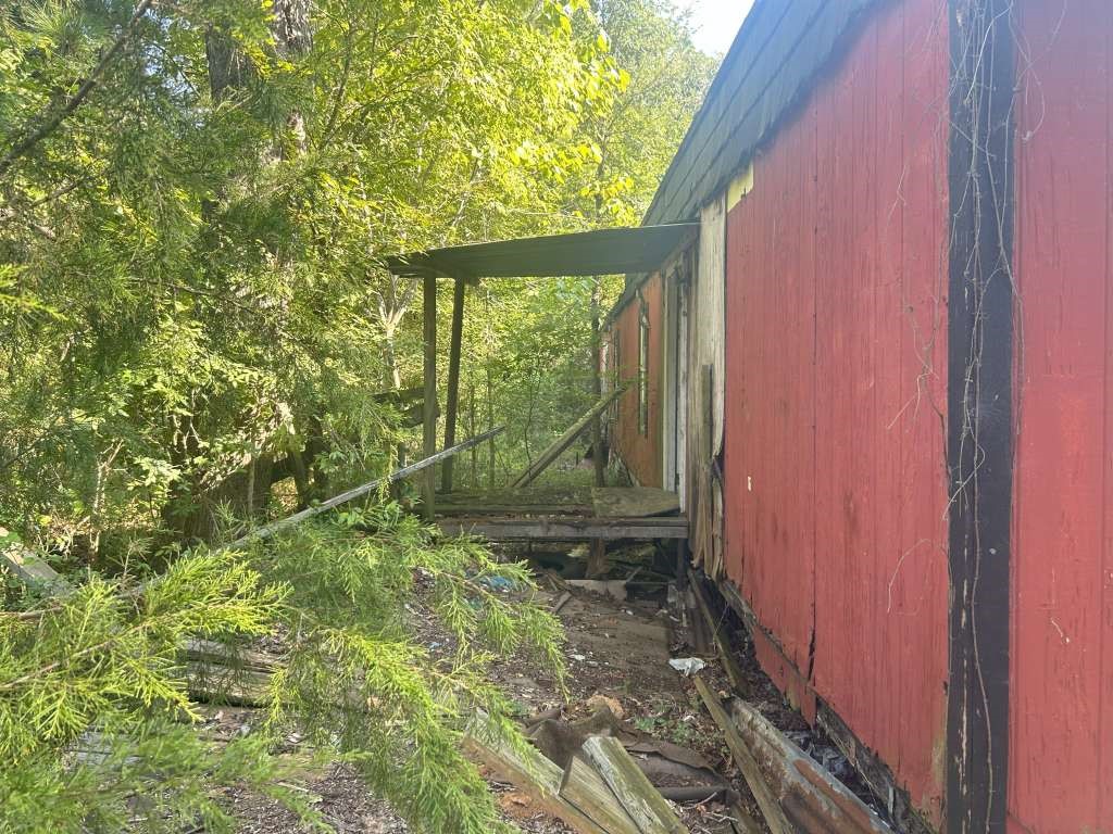 228 Kelly Drive Trinity, TX 75862 - Photo 2 of 5 a view of a back yard from a room