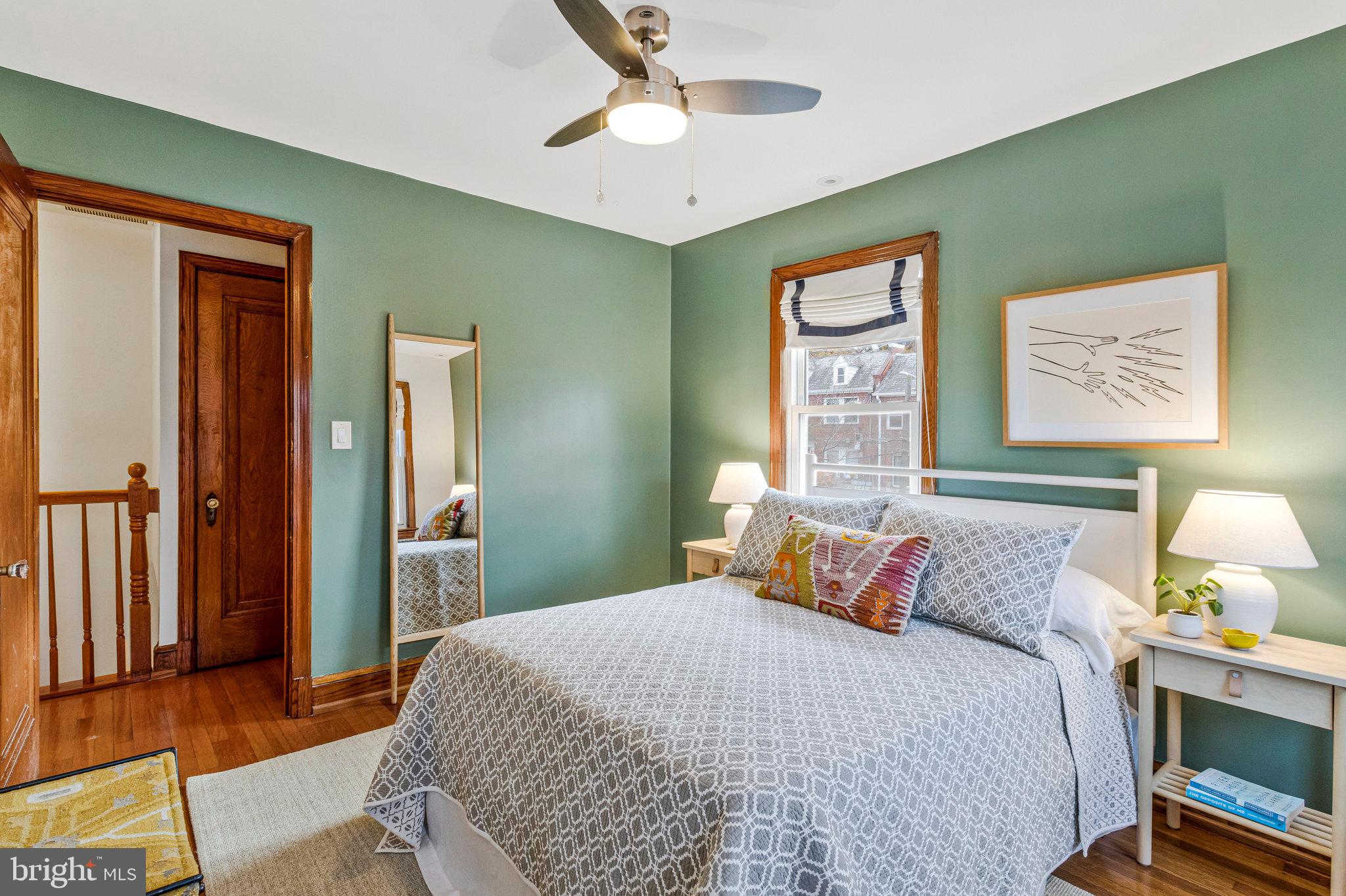 4900 1st Street Northwest Washington, DC 20011 - Photo 14 of 35 a bedroom with a bed and a painting on the wall