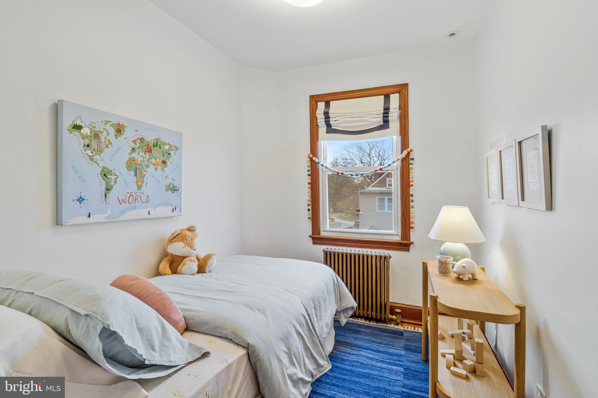 4900 1st Street Northwest Washington, DC 20011 - Photo 15 of 35 a bedroom with a bed and wooden floor