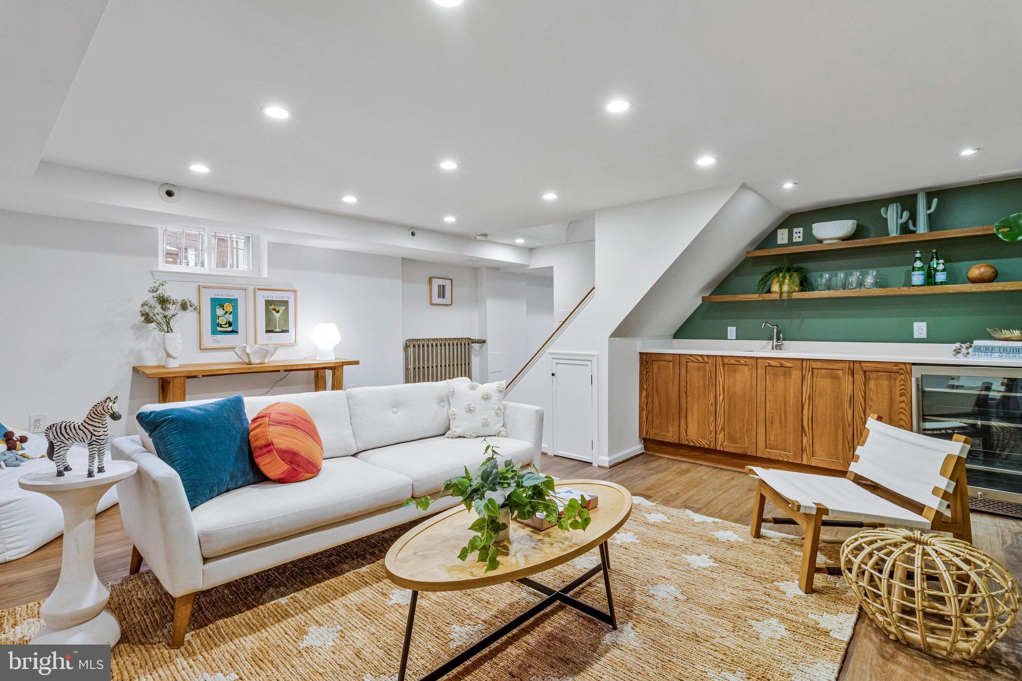 4900 1st Street Northwest Washington, DC 20011 - Photo 17 of 35 a living room with furniture kitchen view and a wooden floor