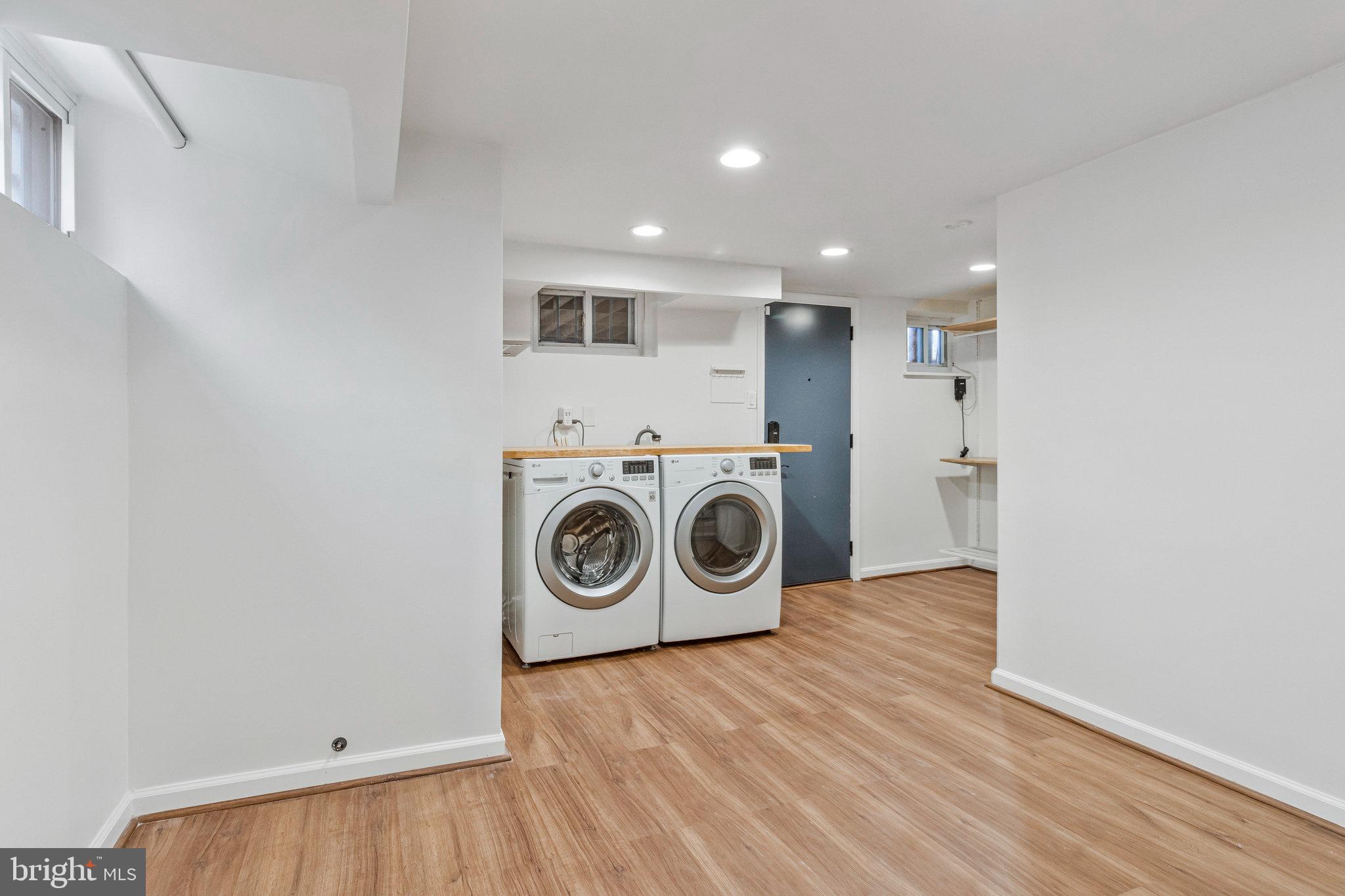 4900 1st Street Northwest Washington, DC 20011 - Photo 21 of 35 a view of a hallway with washer and dryer