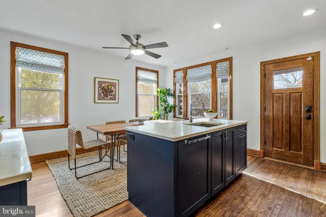 a kitchen with stainless steel appliances granite countertop a refrigerator stove a sink and dishwasher