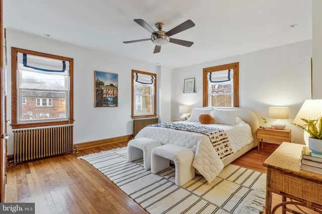a bedroom with a large bed and a window