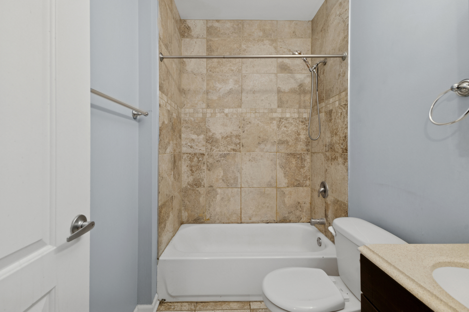 9222 South Laflin Street, Unit 2N Chicago, IL 60620 - Photo 11 of 14 a bathroom with a toilet and a bath tub