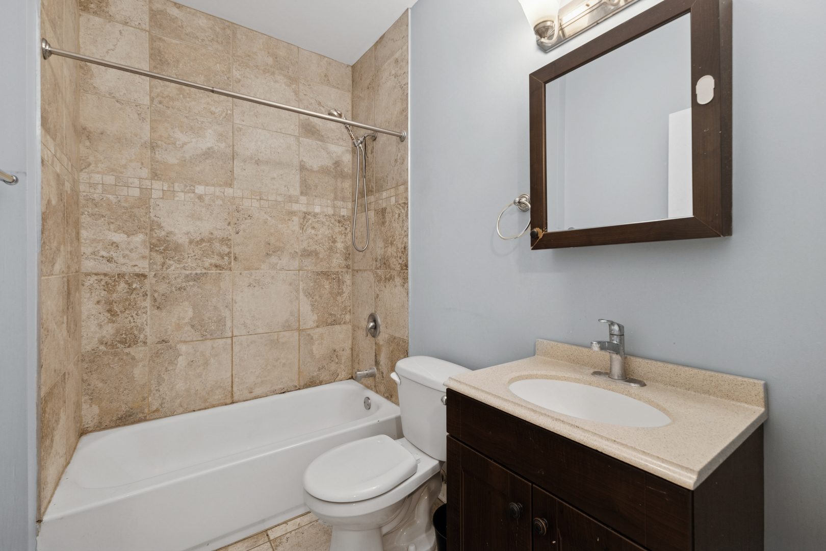 9222 South Laflin Street, Unit 2N Chicago, IL 60620 - Photo 5 of 14 a bathroom with a sink toilet and shower
