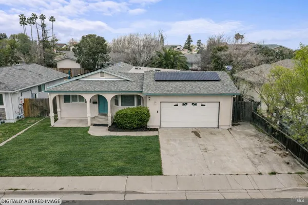 a view of house with outdoor space and garden