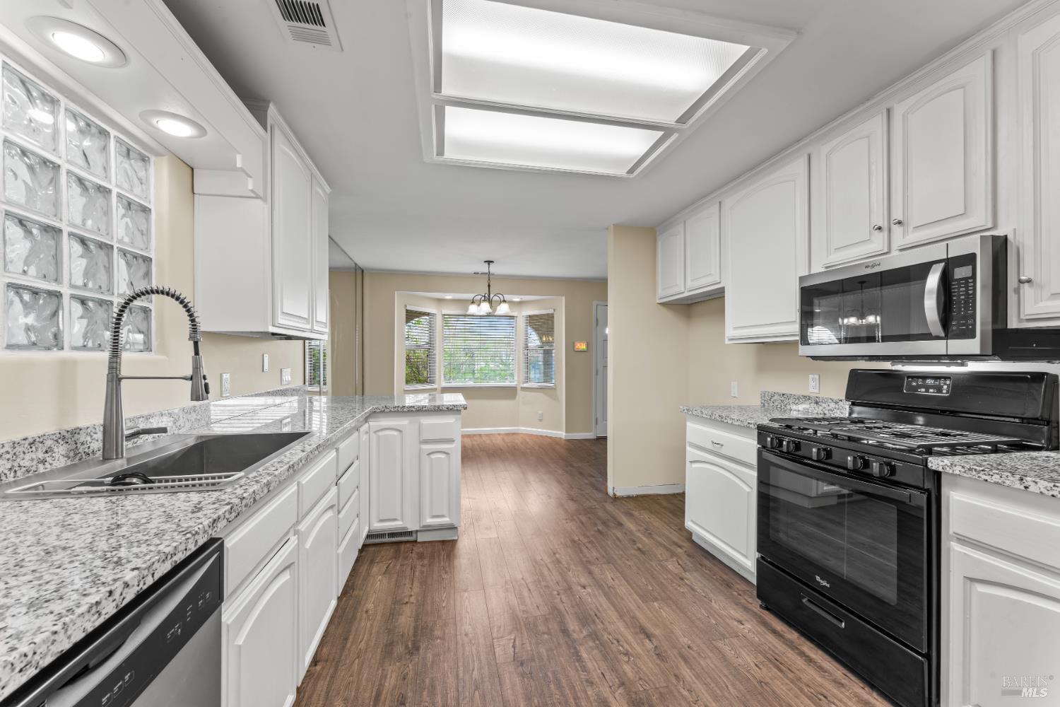 210 Trinity Court Rio Vista, CA 94571 - Photo 14 of 38 a kitchen with granite countertop a sink stove and refrigerator