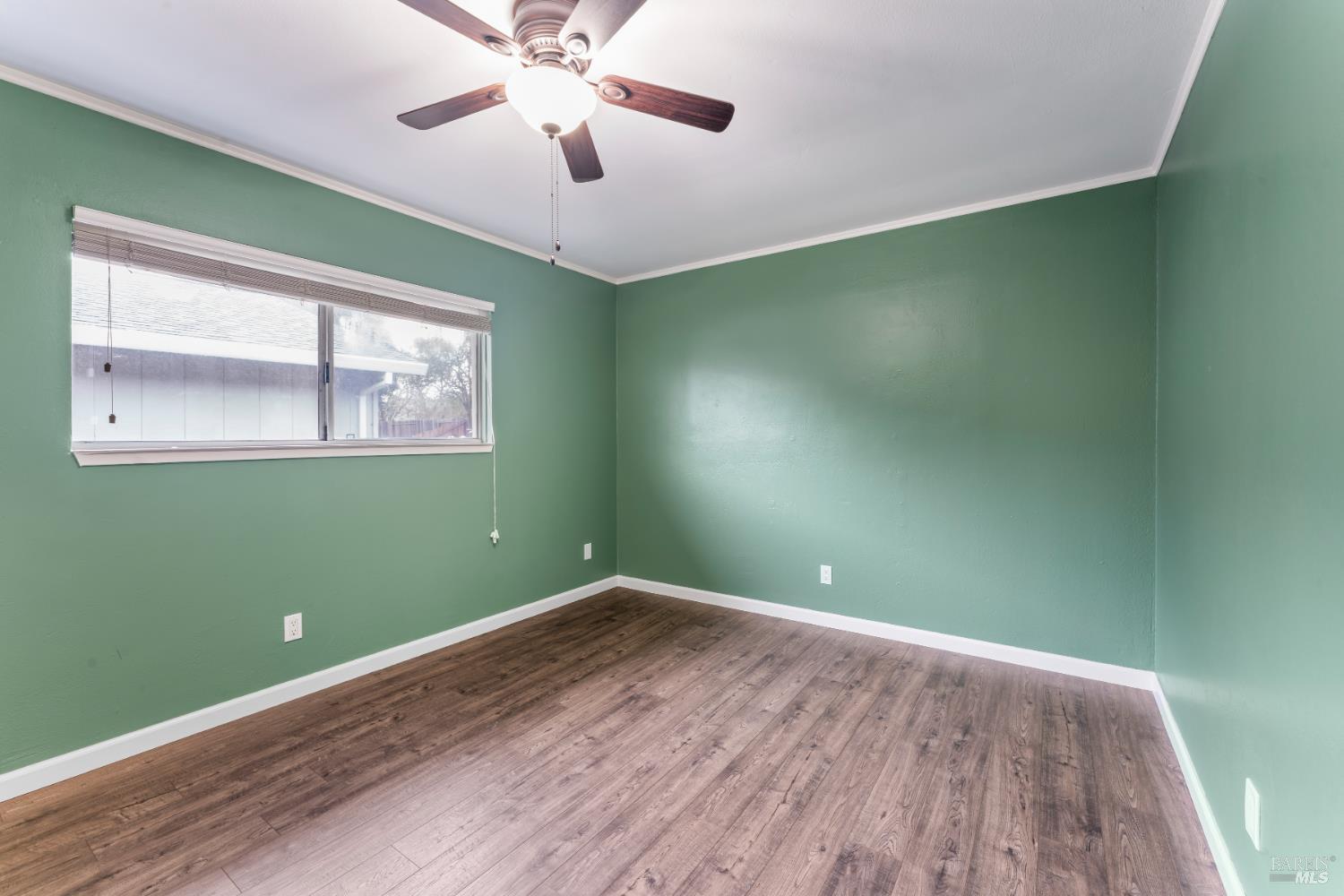 210 Trinity Court Rio Vista, CA 94571 - Photo 22 of 38 an empty room with a window and a fan
