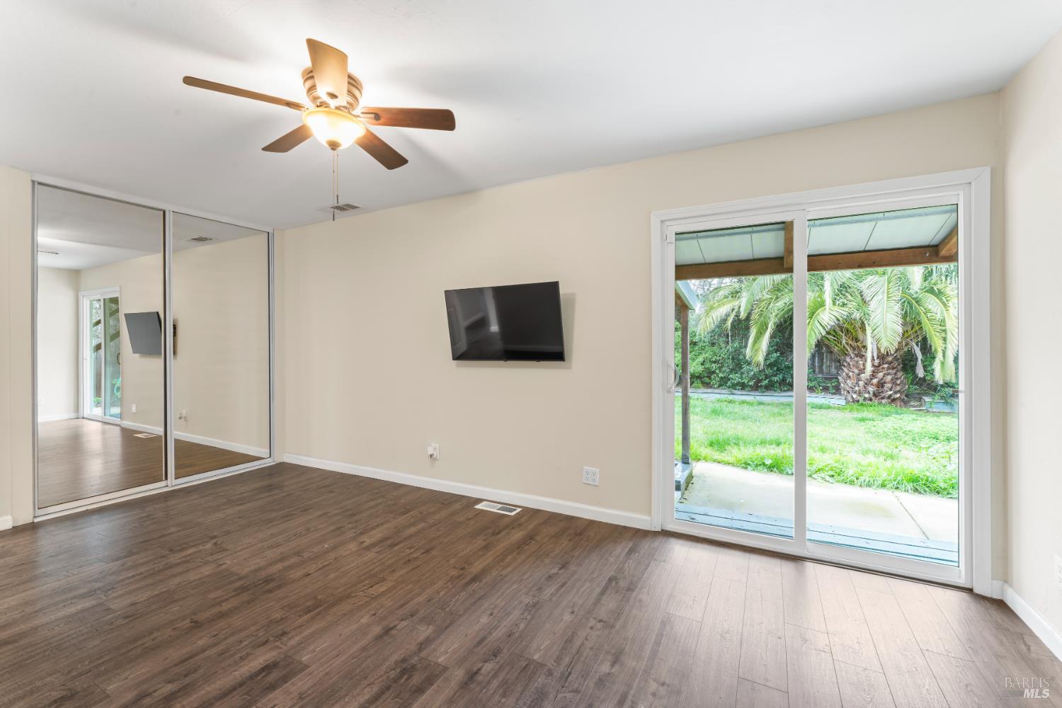 210 Trinity Court Rio Vista, CA 94571 - Photo 24 of 38 a view of an empty room with wooden floor and a window