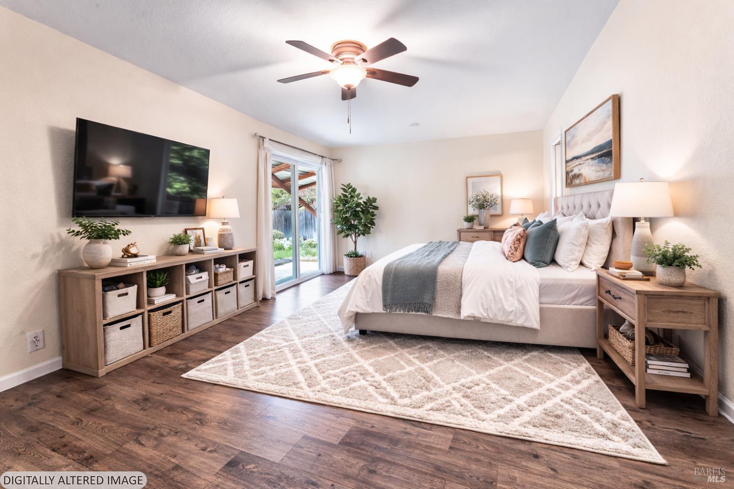 210 Trinity Court Rio Vista, CA 94571 - Photo 26 of 38 a bedroom with a bed and a flat screen tv