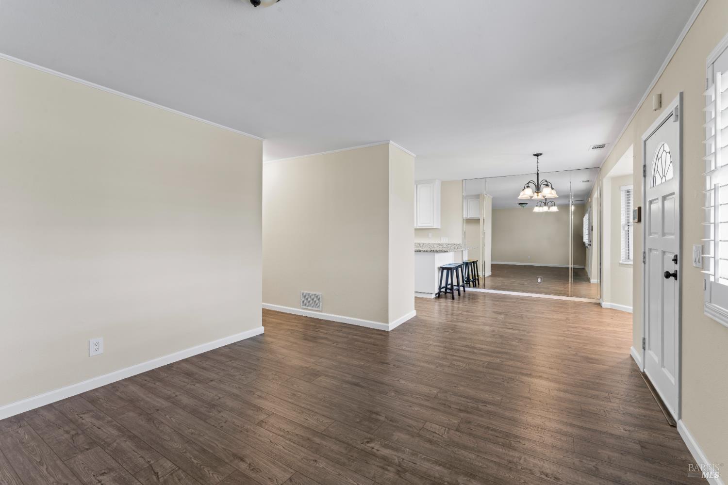 210 Trinity Court Rio Vista, CA 94571 - Photo 6 of 38 a view of a room with wooden floor and a kitchen