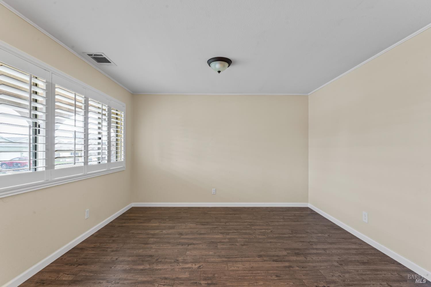 210 Trinity Court Rio Vista, CA 94571 - Photo 7 of 38 wooden floor in an empty room with a window