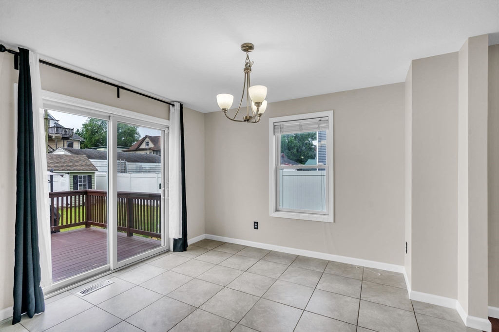 25 Thomas Street Chicopee, MA 01013 - Photo 11 of 36 a view of an empty room with window