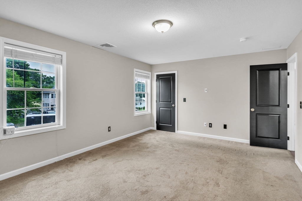25 Thomas Street Chicopee, MA 01013 - Photo 12 of 36 an empty room with windows and closet