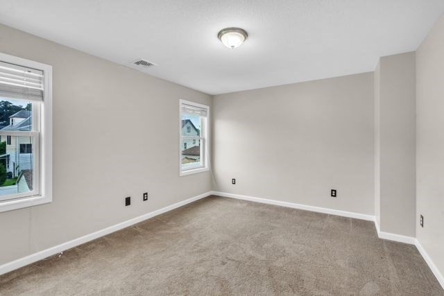 25 Thomas Street Chicopee, MA 01013 - Photo 13 of 36 a view of an empty room with a window
