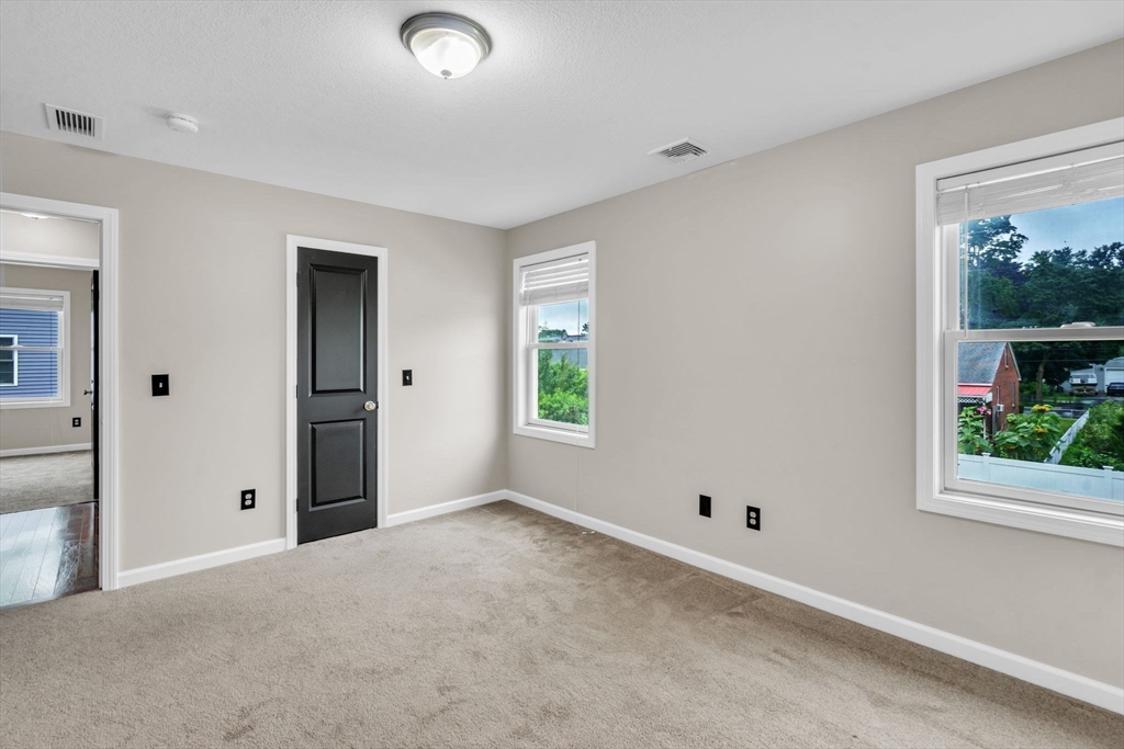 25 Thomas Street Chicopee, MA 01013 - Photo 17 of 36 a view of an empty room with window