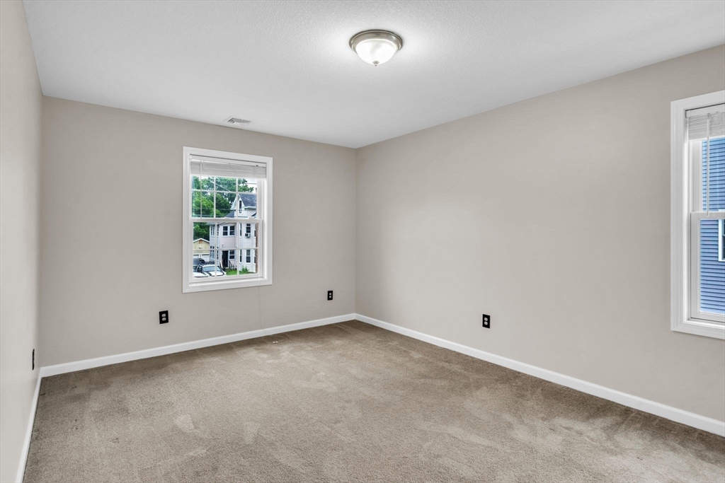 25 Thomas Street Chicopee, MA 01013 - Photo 18 of 36 an empty room with windows