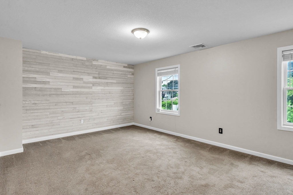 25 Thomas Street Chicopee, MA 01013 - Photo 20 of 36 a view of an empty room with a window