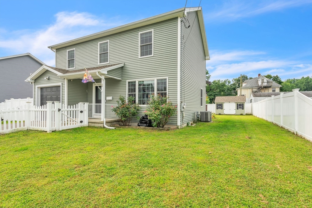 25 Thomas Street Chicopee, MA 01013 - Photo 3 of 36 a backyard of a house with table and chairs