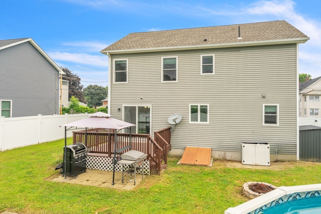 25 Thomas Street Chicopee, MA 01013 - Photo 33 of 36 a backyard of a house with table and chairs