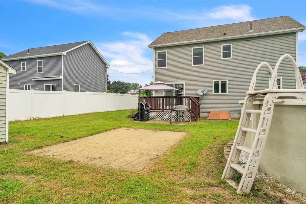 25 Thomas Street Chicopee, MA 01013 - Photo 34 of 36 a backyard of a house with table and chairs