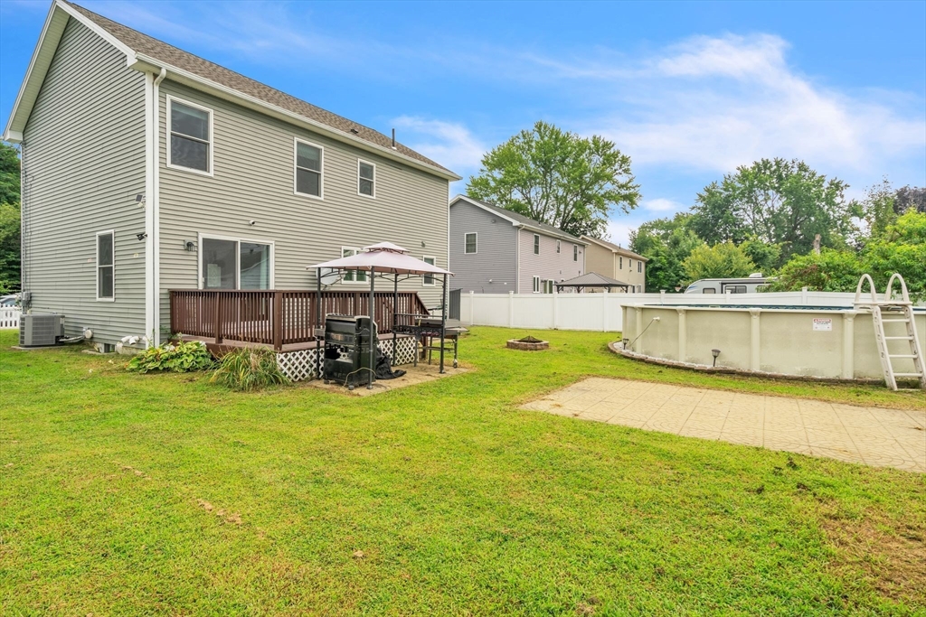 25 Thomas Street Chicopee, MA 01013 - Photo 35 of 36 a view of a house with backyard and a tree