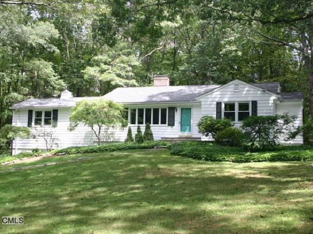 19 Laurel Hill Road Ridgefield, CT 06877 - Photo 1 of 1 a front view of a house with a garden