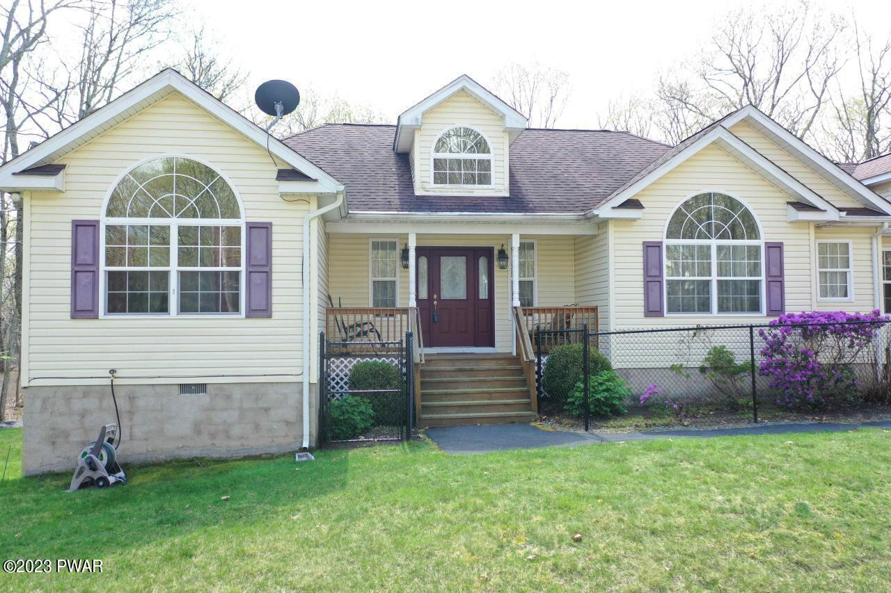 131 Maple Ridge Road Milford, PA 18337 - Photo 2 of 54 a front view of a house with garden