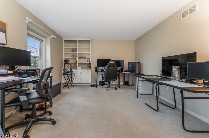 2103 Jamestown Common Hillsborough, NJ 08844 - Photo 13 of 18 a view of a workspace with furniture and a window