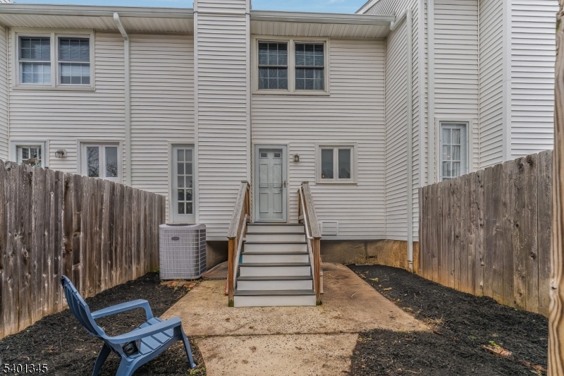 2103 Jamestown Common Hillsborough, NJ 08844 - Photo 18 of 18 a view of a house with wooden fence and two windows