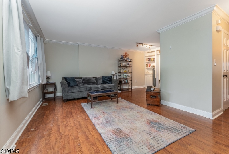 2103 Jamestown Common Hillsborough, NJ 08844 - Photo 3 of 18 a living room with furniture and a wooden floor
