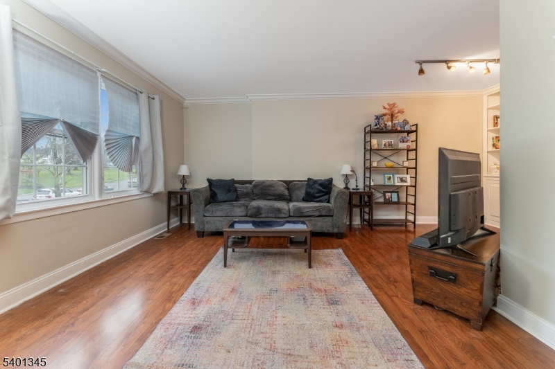 2103 Jamestown Common Hillsborough, NJ 08844 - Photo 4 of 18 a living room with furniture a rug and a large window