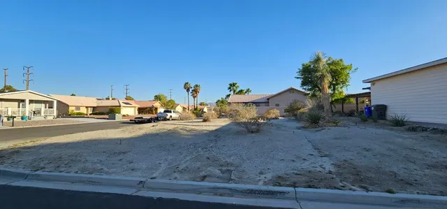 a view of street with parked cars