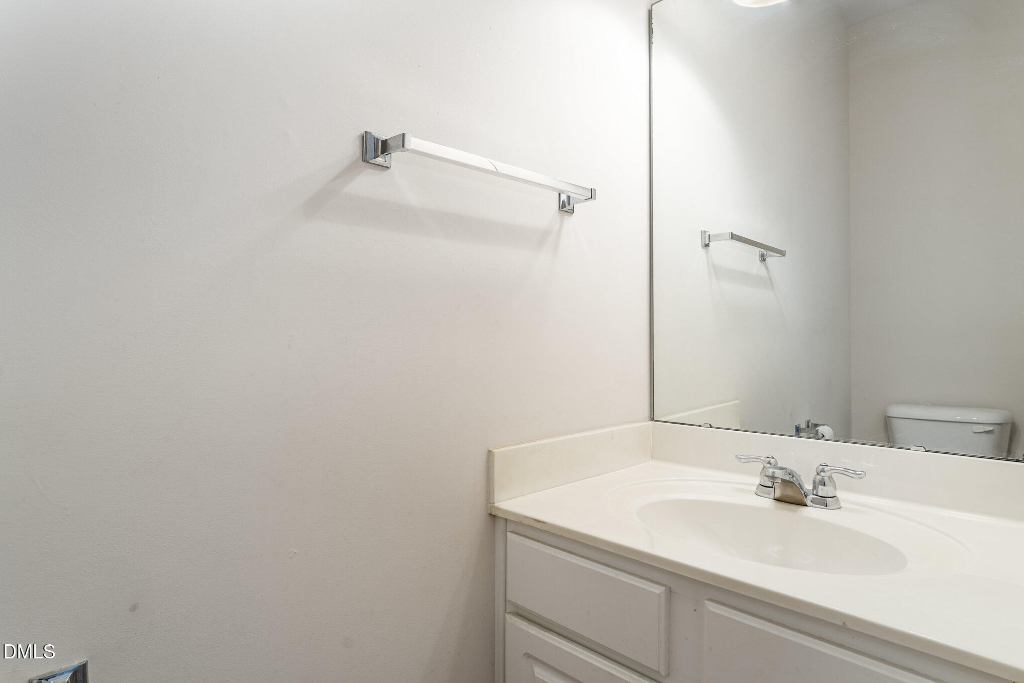 12347 Honeychurch Street Raleigh, NC 27614 - Photo 19 of 62 a bathroom with a sink and a mirror