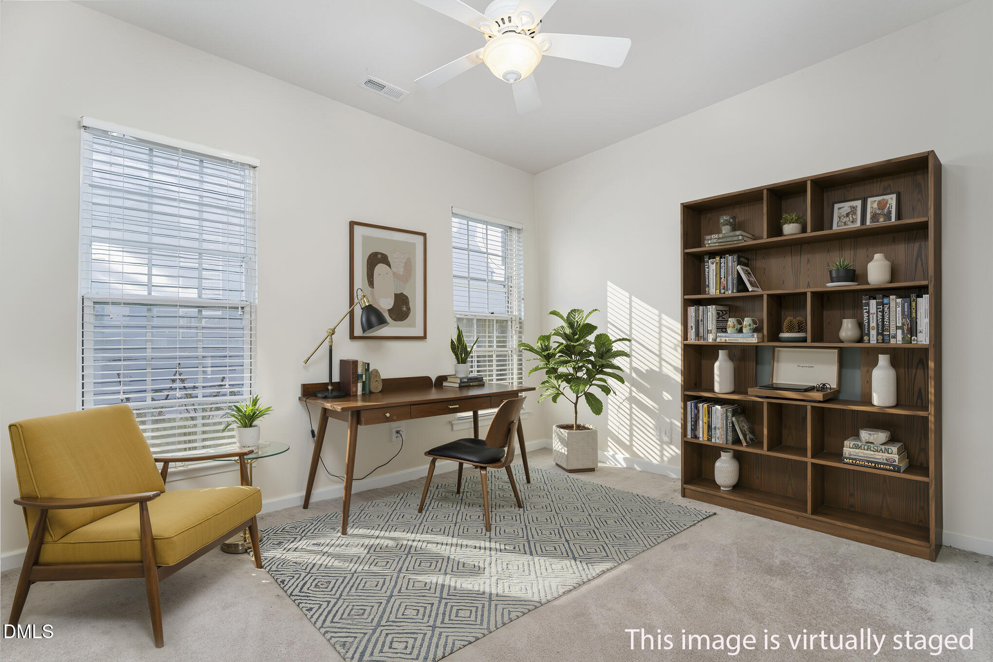 12347 Honeychurch Street Raleigh, NC 27614 - Photo 26 of 62 a living room with furniture and a book shelf