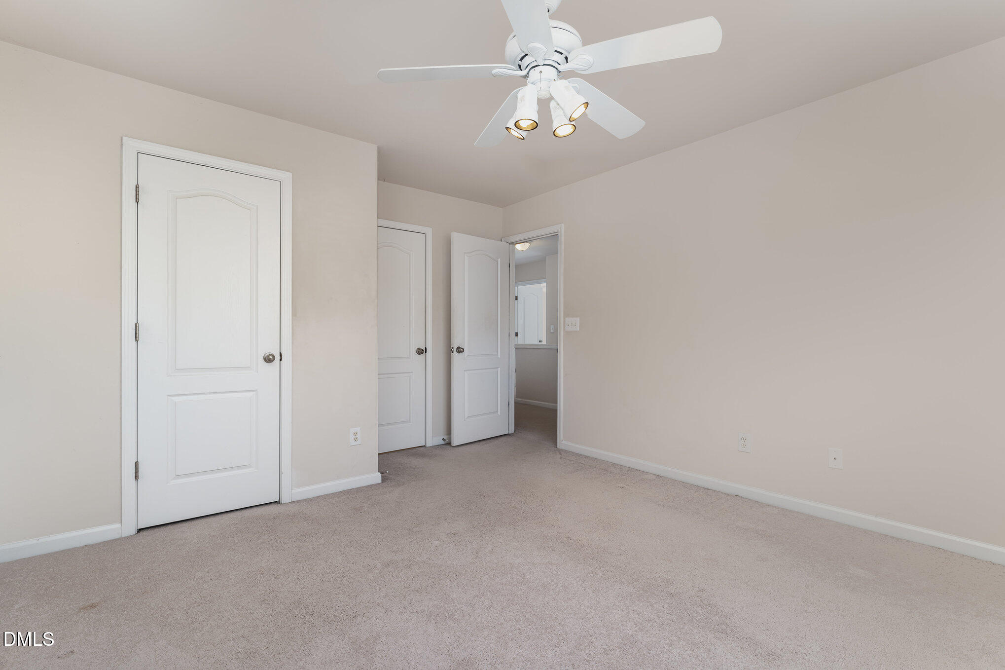 12347 Honeychurch Street Raleigh, NC 27614 - Photo 30 of 62 an empty room with a chandelier fan and closet area