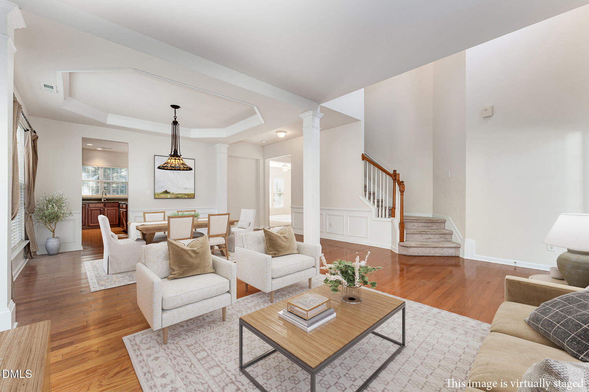 12347 Honeychurch Street Raleigh, NC 27614 - Photo 3 of 62 a living room with furniture a rug and a table