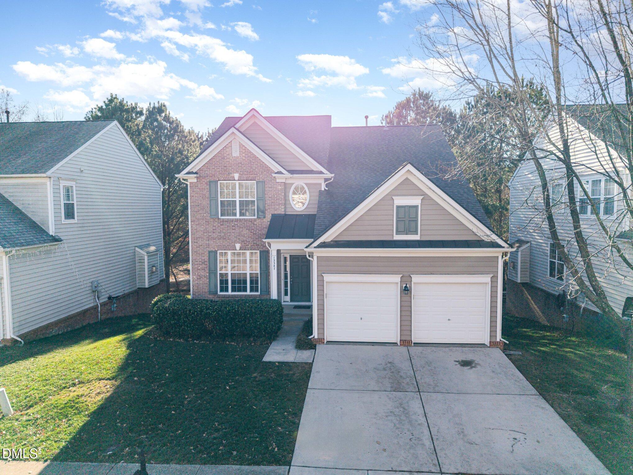 12347 Honeychurch Street Raleigh, NC 27614 - Photo 49 of 62 a front view of a house with yard
