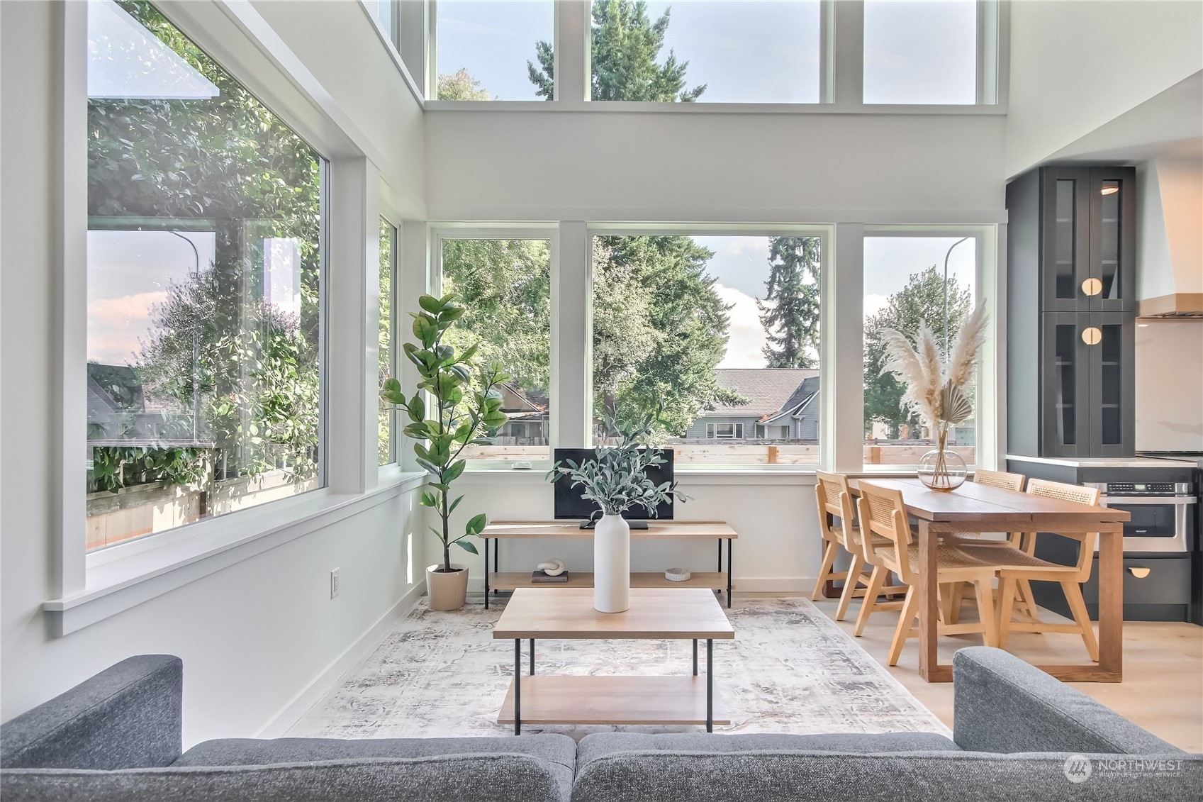6839 35th Avenue Northeast, Unit A Seattle, WA 98115 - Photo 11 of 39 a living room with furniture and a large window