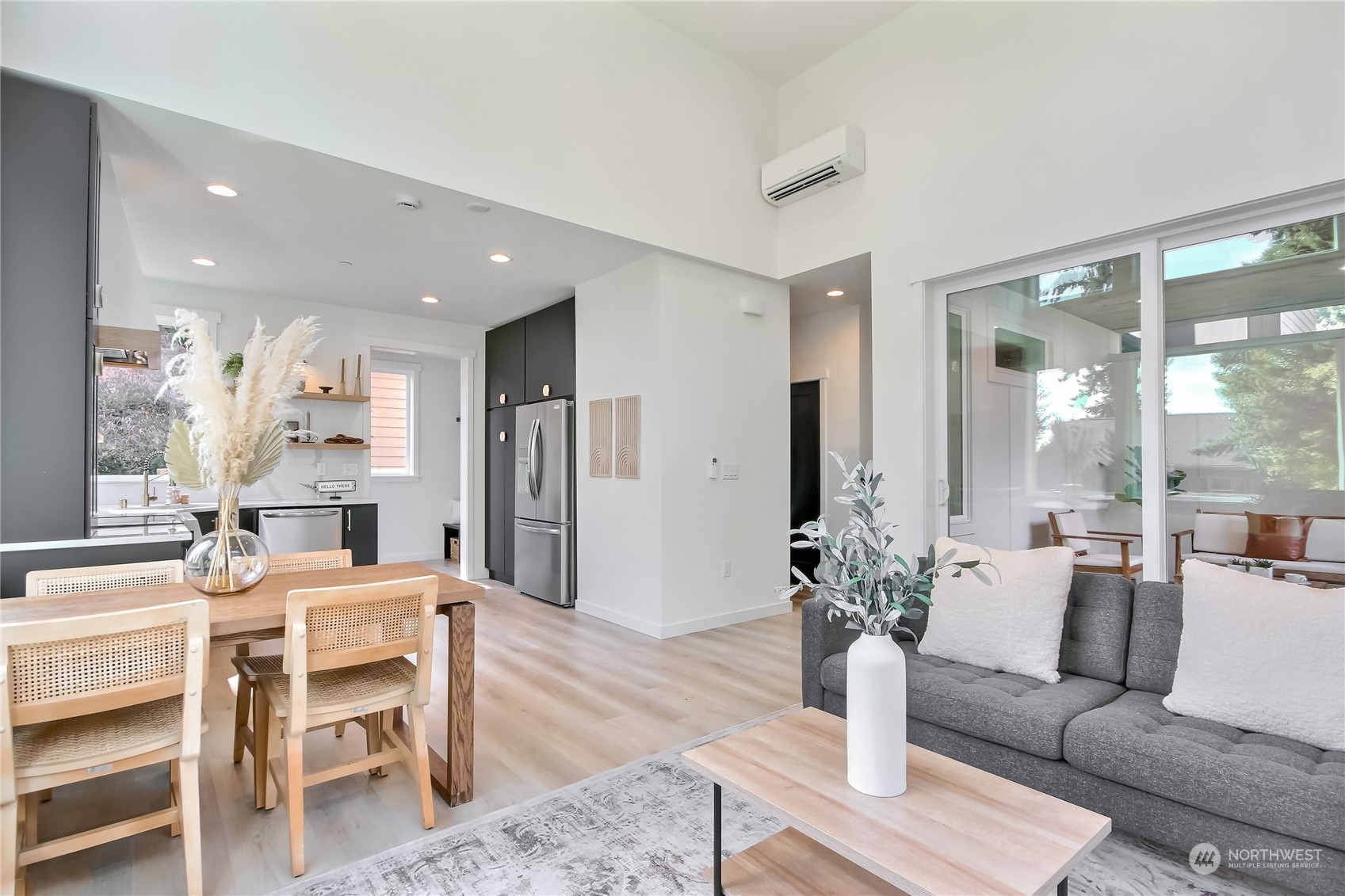 6839 35th Avenue Northeast, Unit A Seattle, WA 98115 - Photo 13 of 39 a living room with furniture wooden floor and a large window