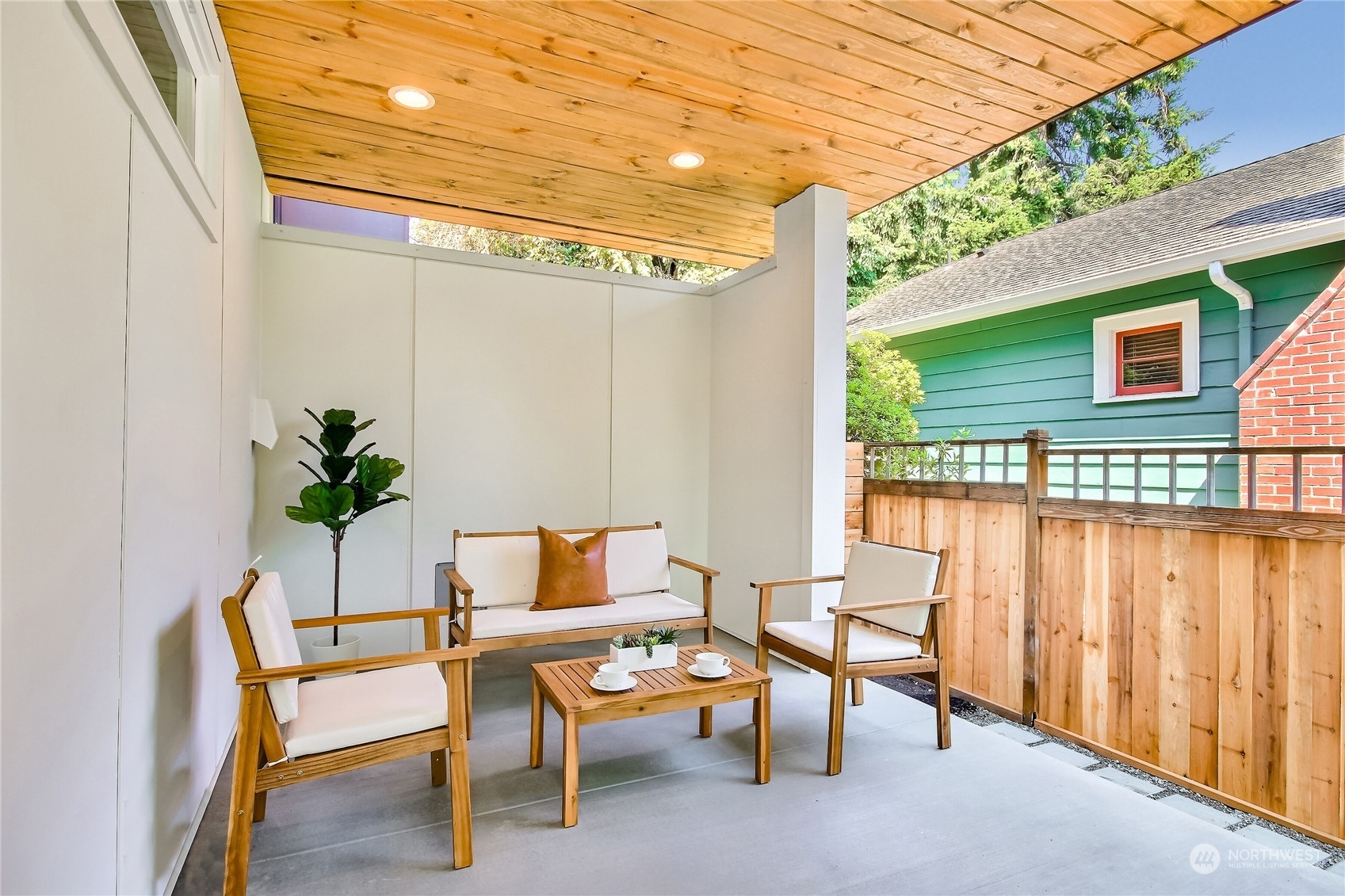 6839 35th Avenue Northeast, Unit A Seattle, WA 98115 - Photo 15 of 39 a balcony with chairs and with potted plants