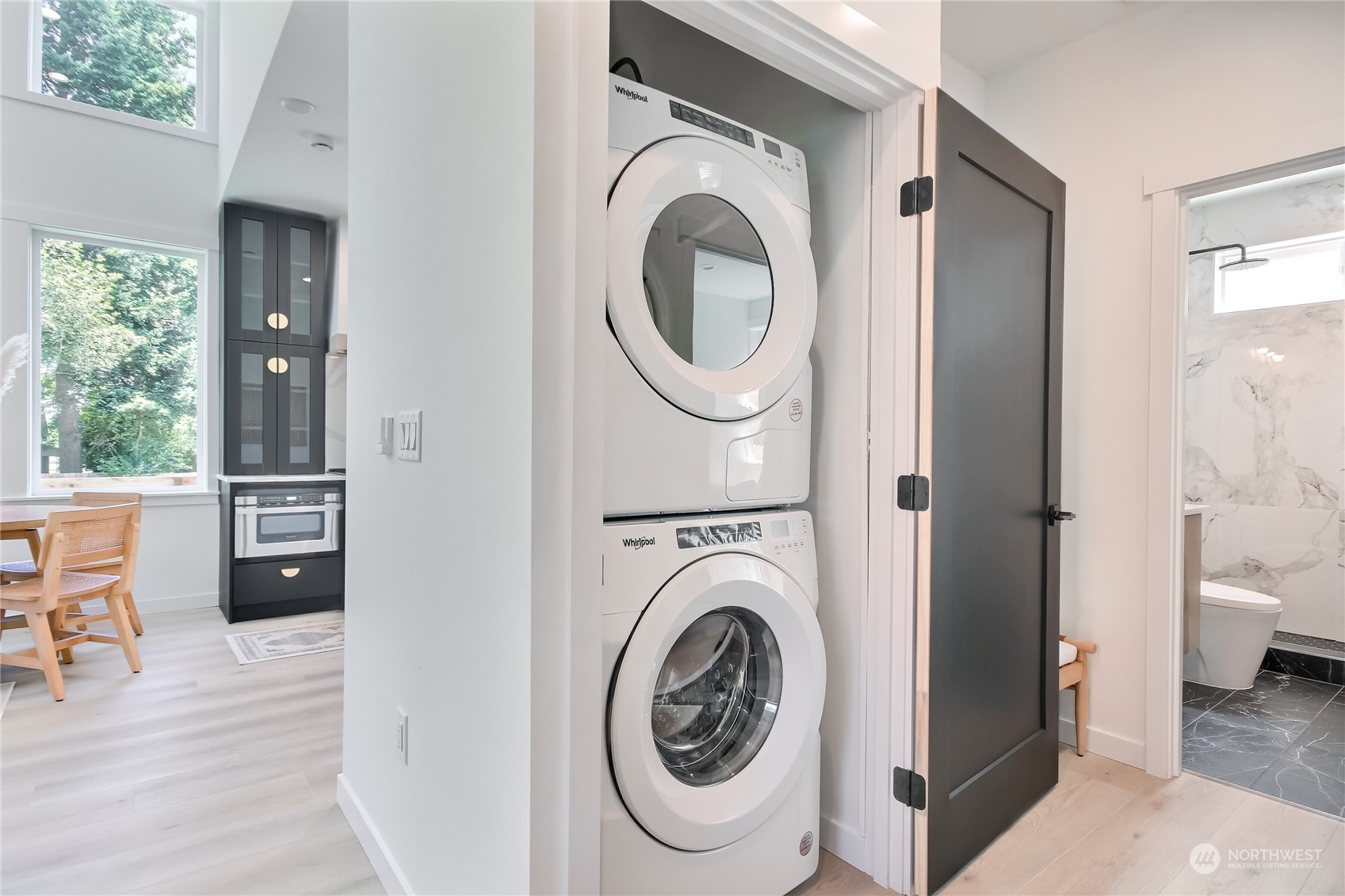 6839 35th Avenue Northeast, Unit A Seattle, WA 98115 - Photo 18 of 39 a view of a hallway with washer and dryer