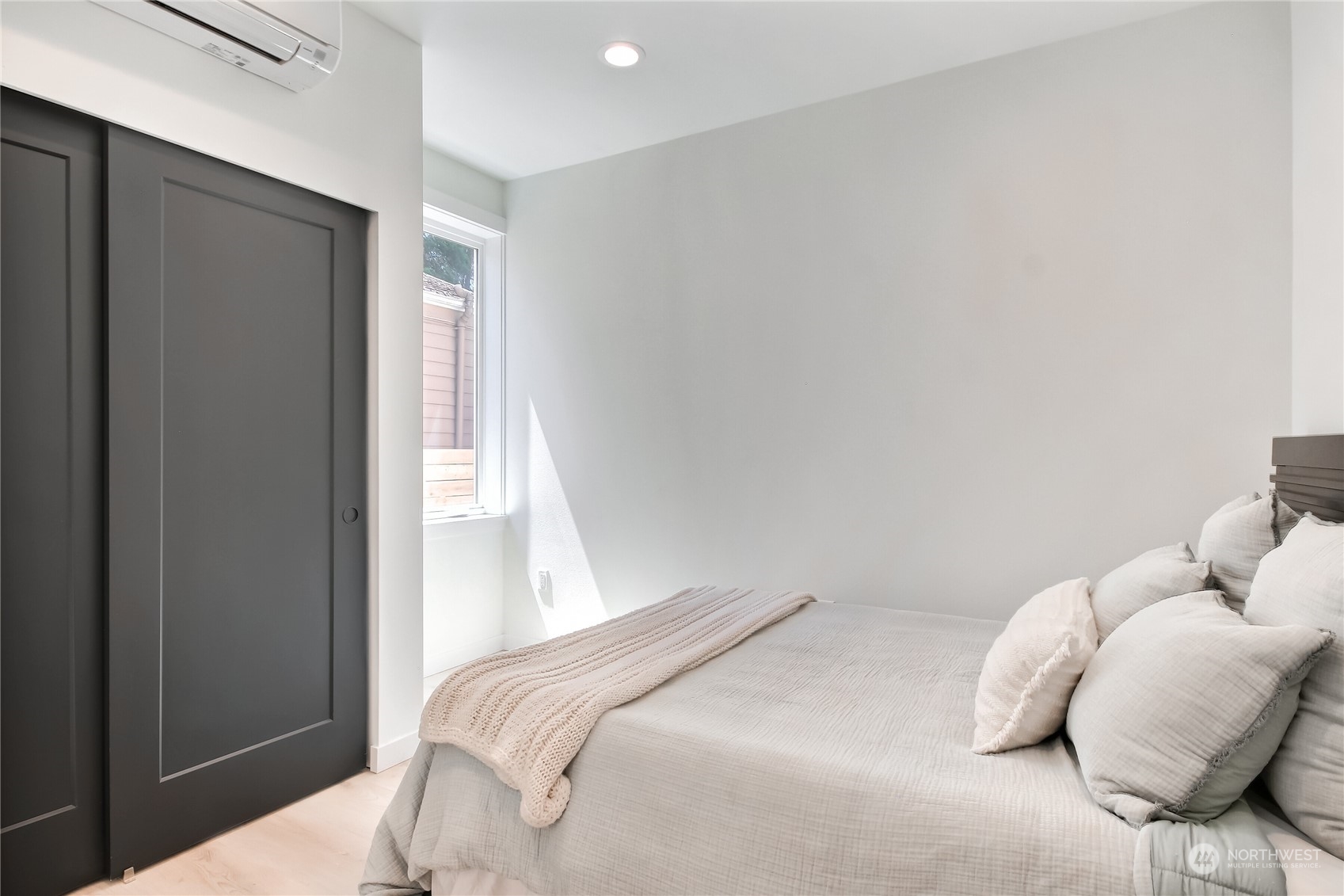 6839 35th Avenue Northeast, Unit A Seattle, WA 98115 - Photo 20 of 39 a bedroom with a bed and a window