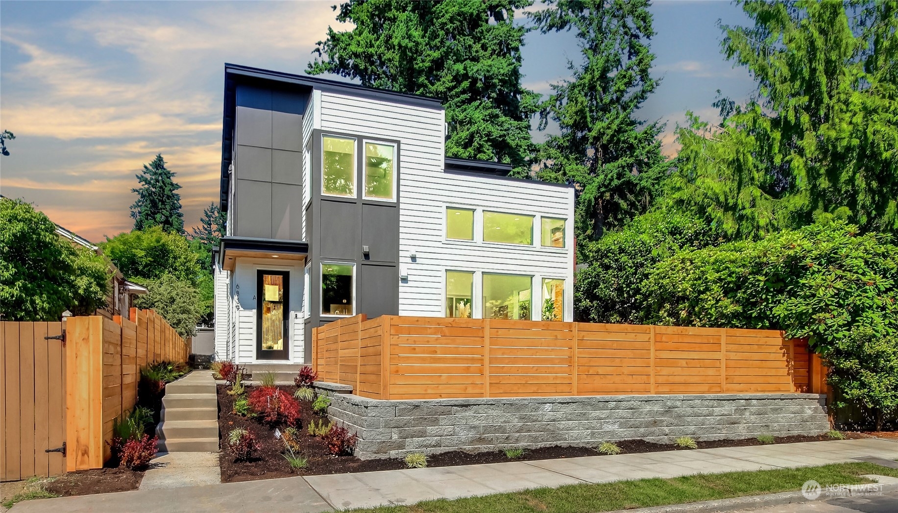6839 35th Avenue Northeast, Unit A Seattle, WA 98115 - Photo 2 of 39 a front view of a house with garage