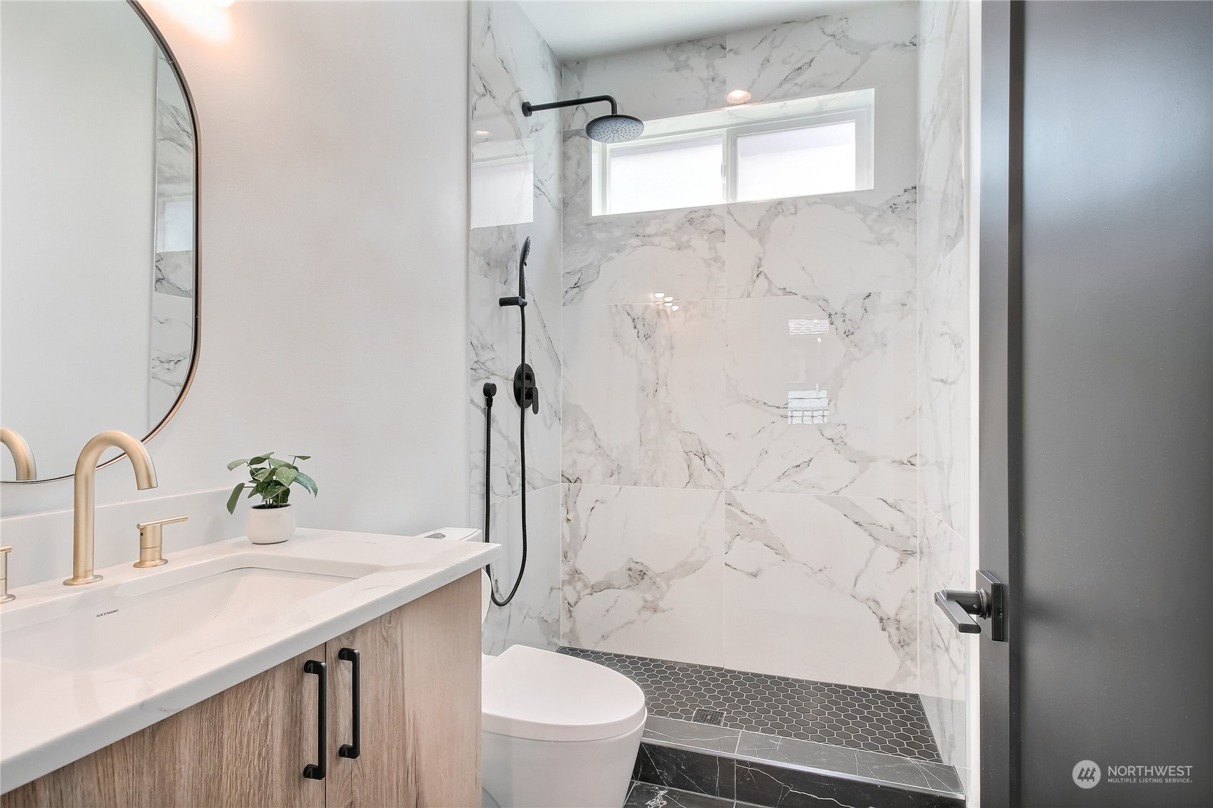 6839 35th Avenue Northeast, Unit A Seattle, WA 98115 - Photo 21 of 39 a bathroom with a sink toilet and shower