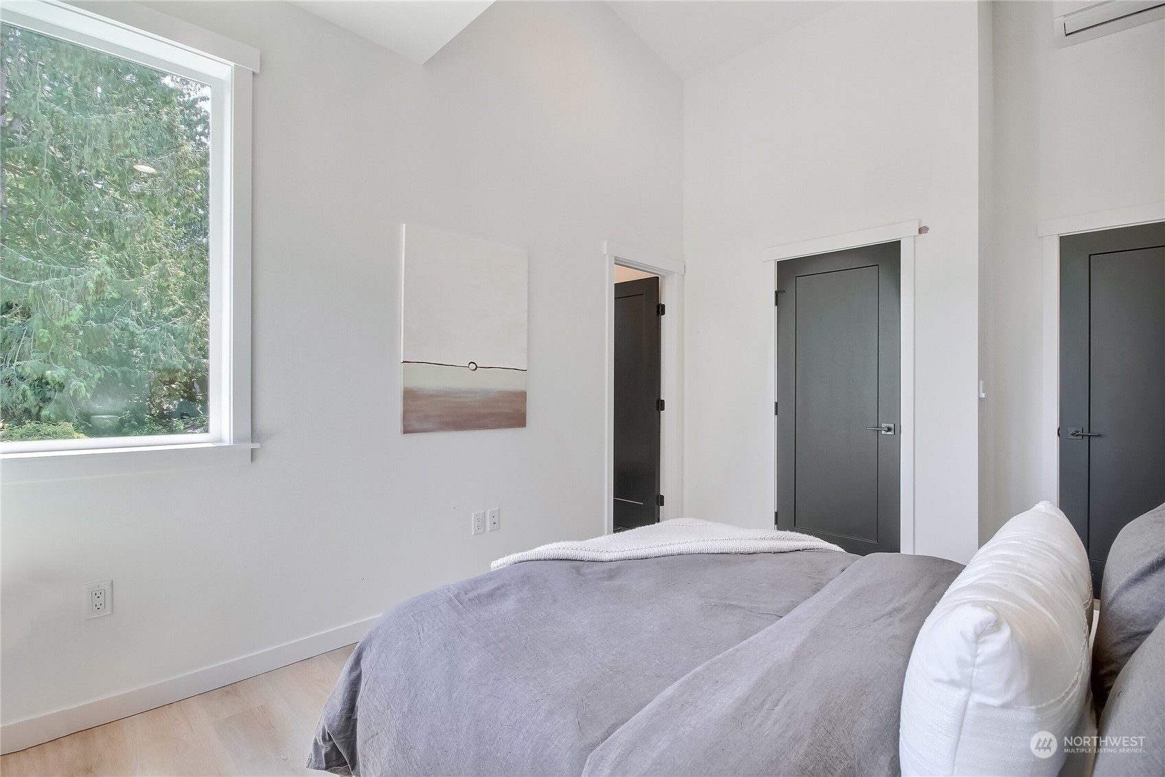 6839 35th Avenue Northeast, Unit A Seattle, WA 98115 - Photo 26 of 39 a bedroom with a bed and a window