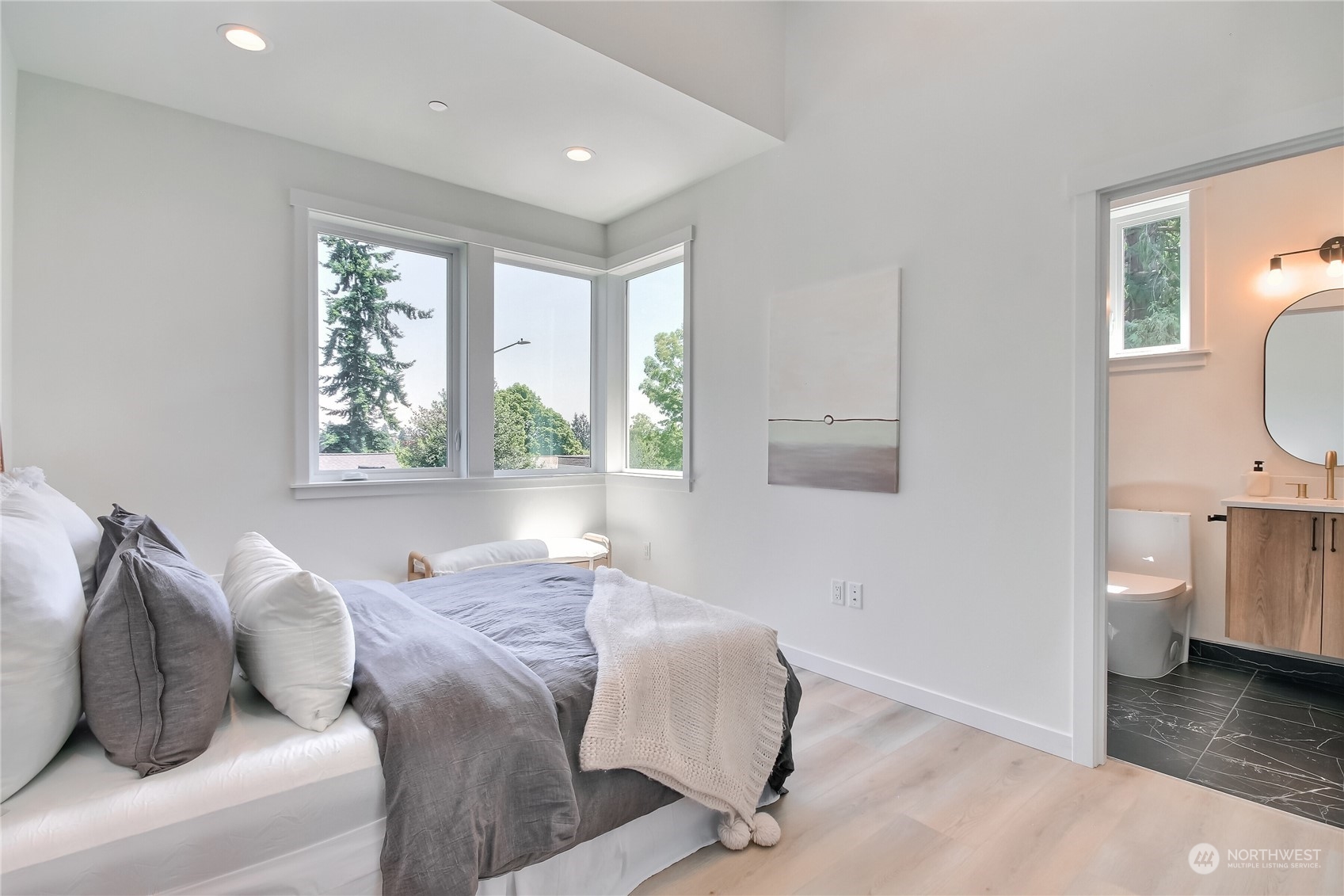 6839 35th Avenue Northeast, Unit A Seattle, WA 98115 - Photo 27 of 39 a bedroom with a bed and a window